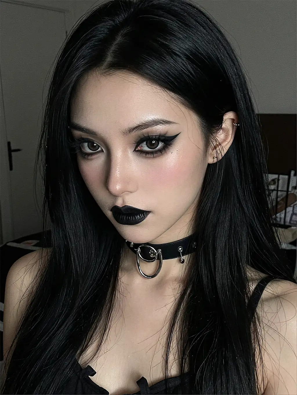 Fictional AI companion with dark eye make-up and a studded choker in a dim room